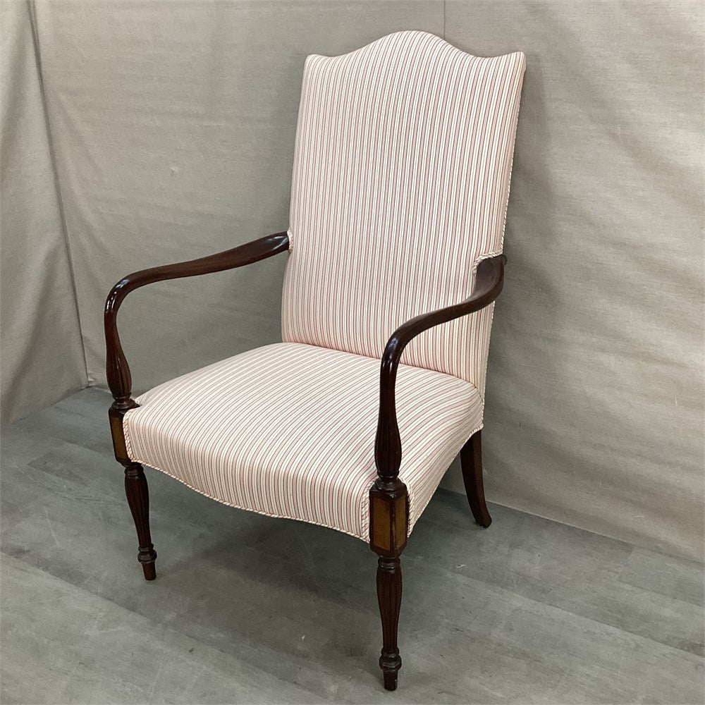 Vintage Sheraton-style mahogany lolling chair with cream striped upholstery, three-quarter view