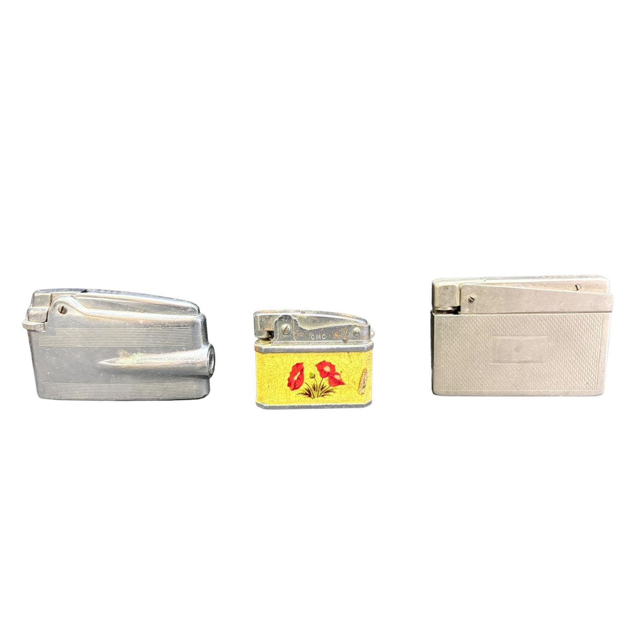 Three vintage lighters including Ronson Varaflame
