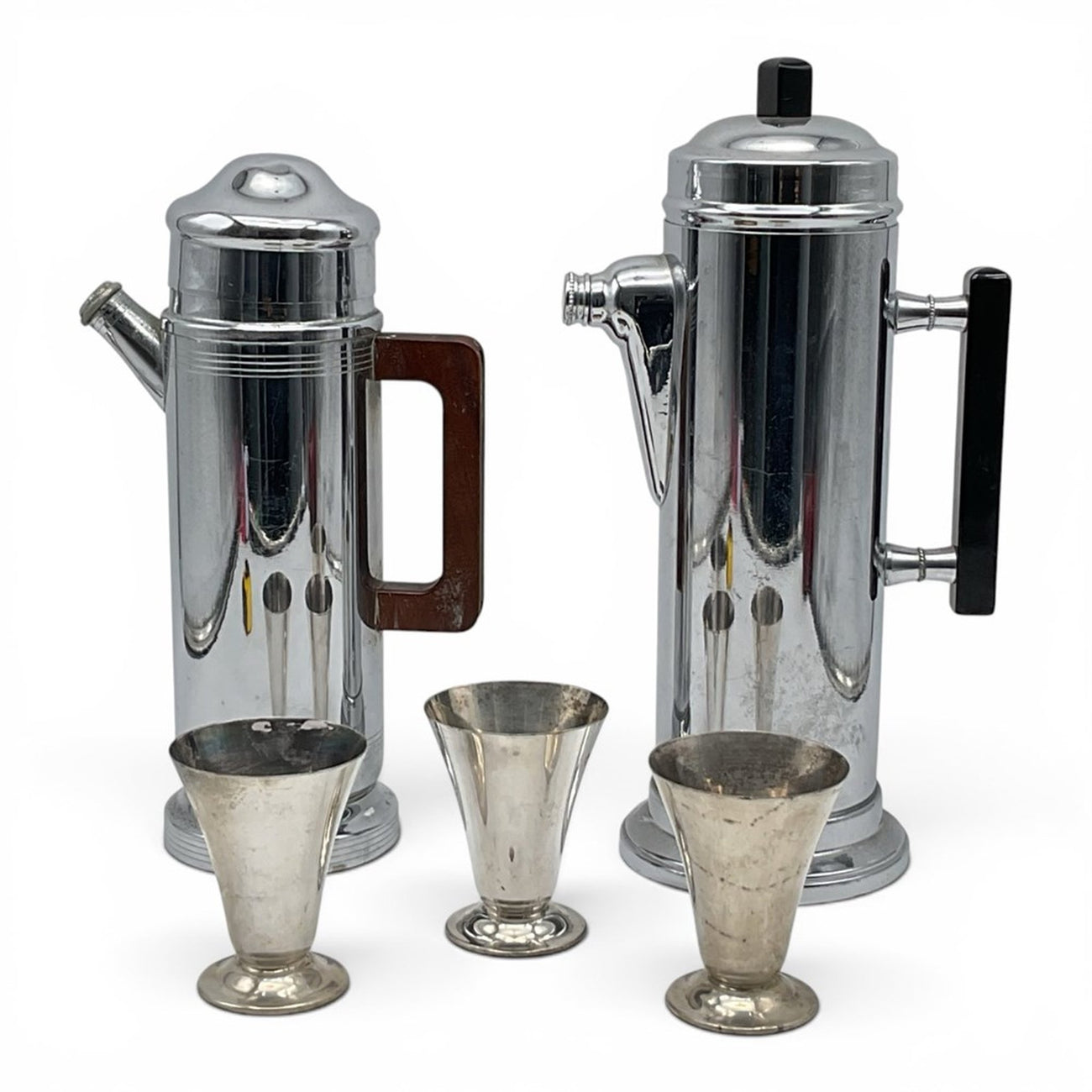 Pair of Art Deco chrome cocktail shakers with cordial cups