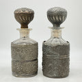 Pair of Derby Silver Co. Quadruple-Plate Repoussé Dresser Bottles with Stoppers, c. 1890