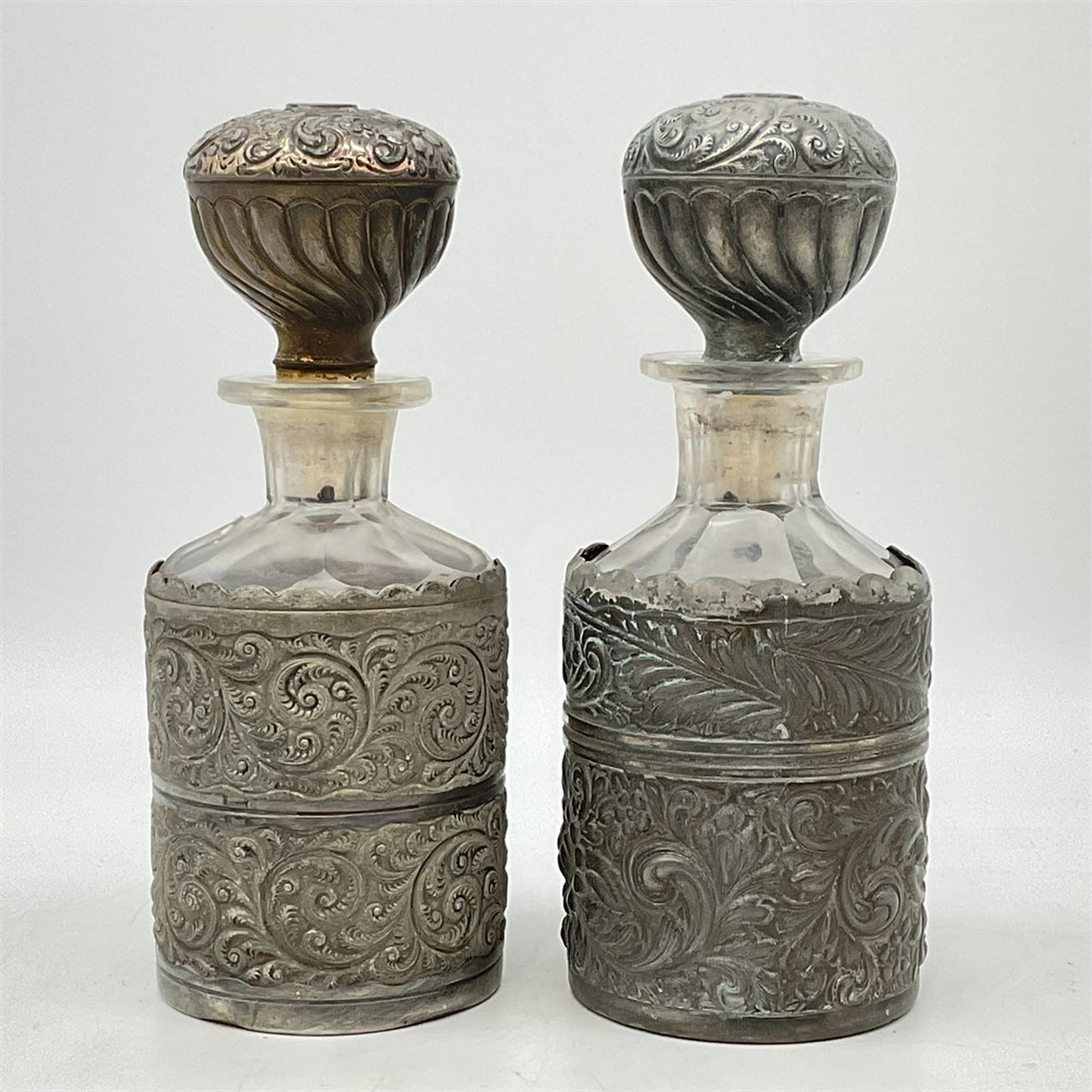 Pair of Derby Silver Co. repoussé dresser bottles