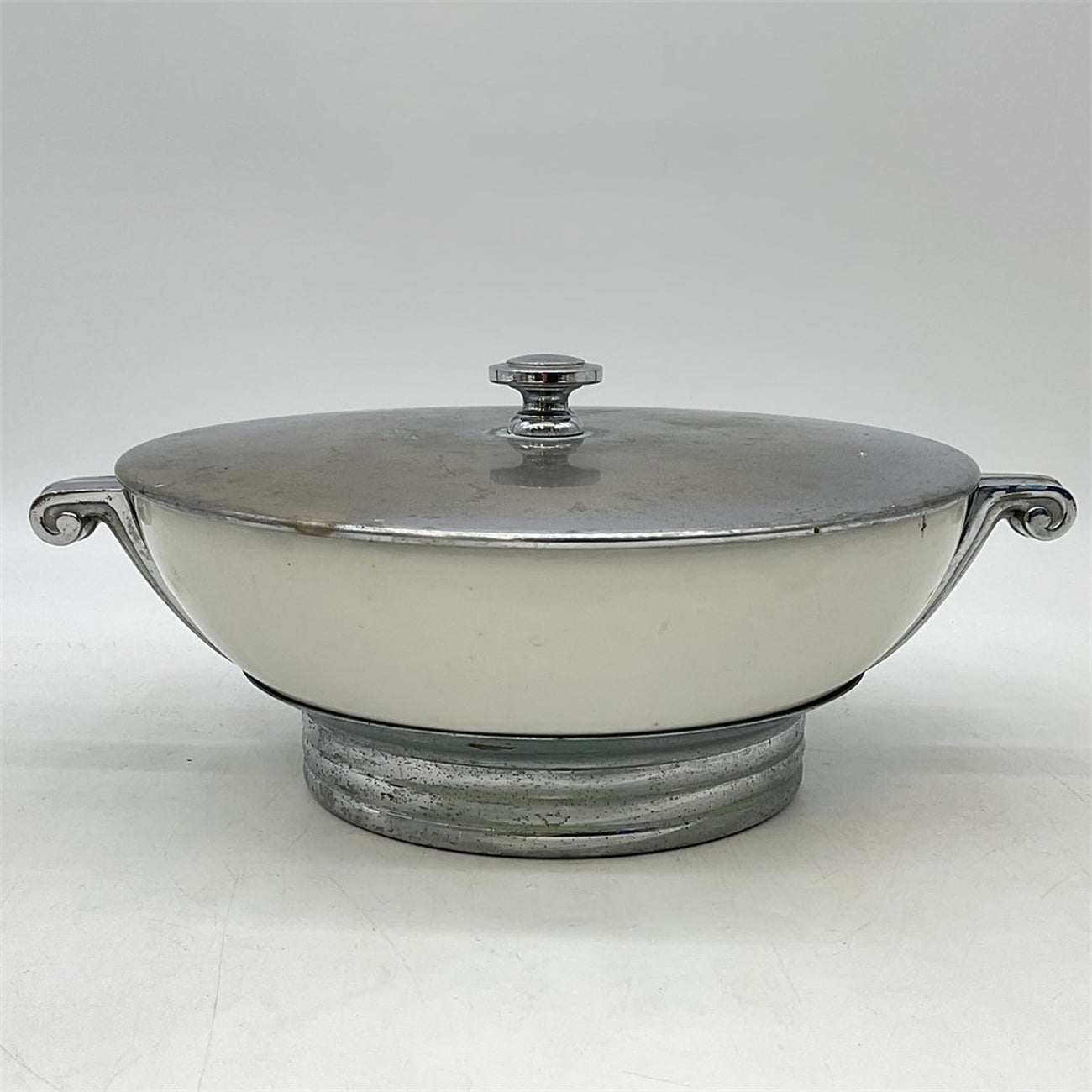 Manning-Bowman chrome covered server with porcelain insert